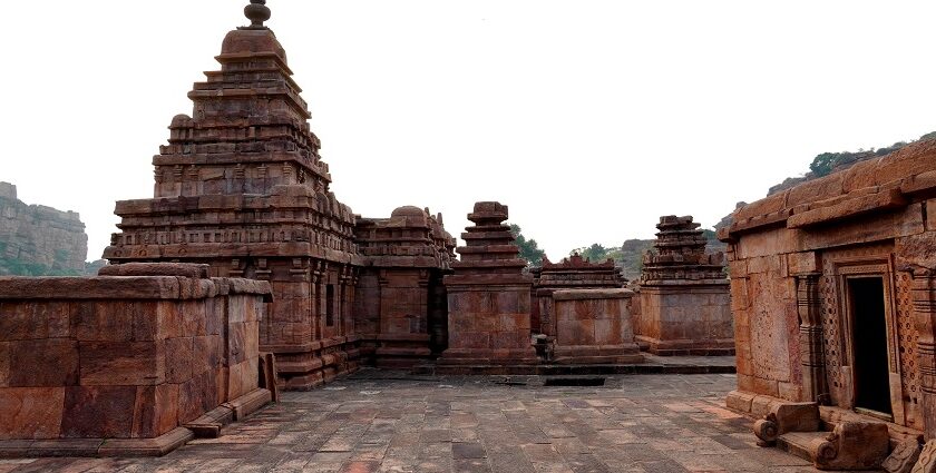 Image of a temple with historical significance architecture surrounded by lush greenery - Bhootnath temple