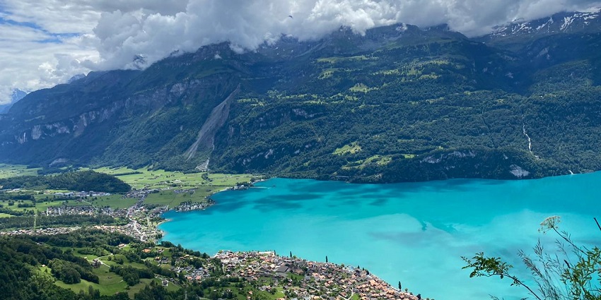 View of Crystal-clear lake surrounded by stunning Swiss mountain scenery