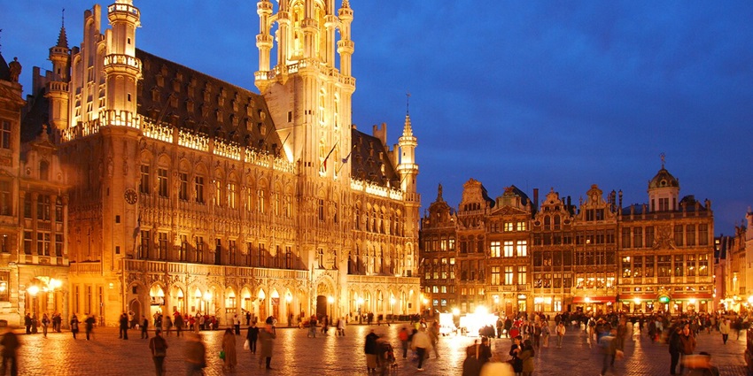 Historic central square surrounded by ornate buildings and landmarks.