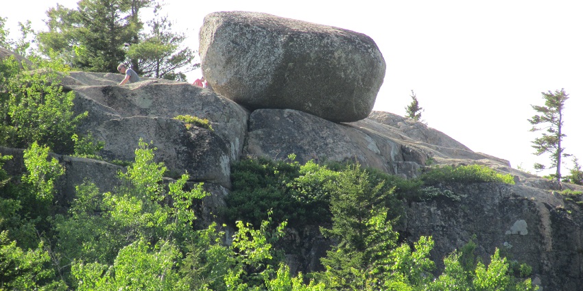 Bubble Rock on a smaller rock, a popular geological formation in Acadia National Park.