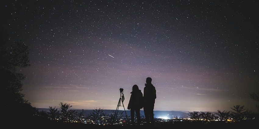 A view of a couple stargazing- one of the unique ways of spending Valentine's Day in Pittsburgh.