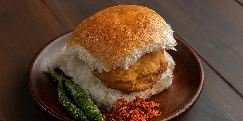 The street food in Dehradun features spiced potato patties served in soft buns.