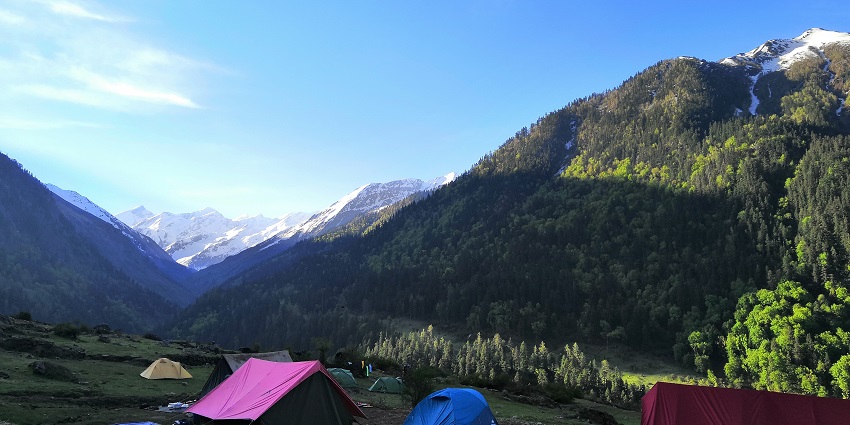 The best beach camping in Rishikesh featuring water sports and lush greenery.