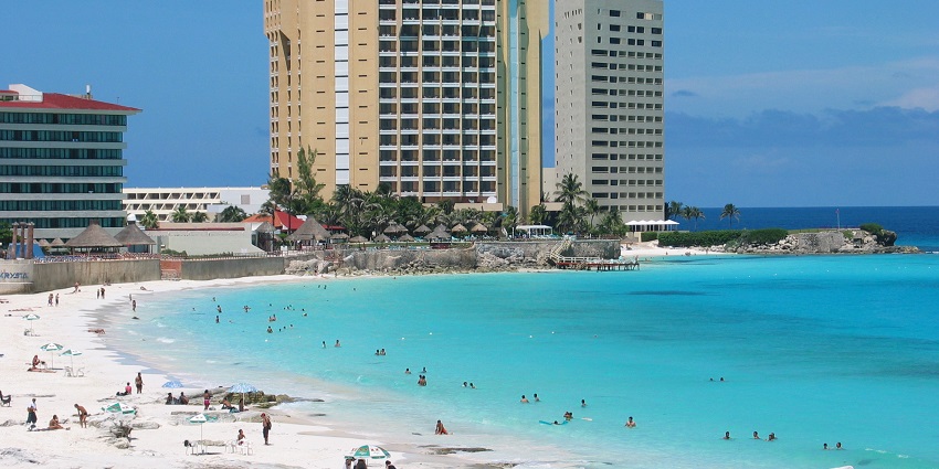 Enjoy a romantic sunset on Cancun's pristine beaches in Mexico or a picnic day