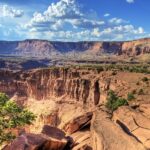 An image of the dramatic sandstone cliffs and layered rock formations.