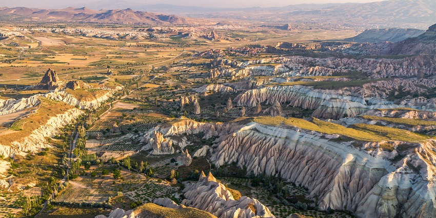 Skydiving in Turkey in Cappadocia with fairy chimneys, and cave dwellings.