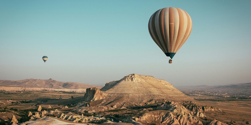 Valentines Day in Turkey with unique fairy chimneys, caves, and hot air balloon landscapes.