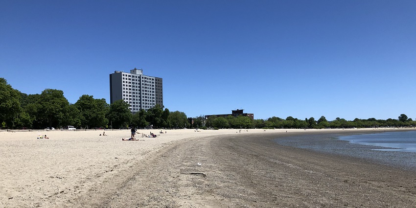 View of Carson Beach in South Boston, featuring the sandy shore and calm waters