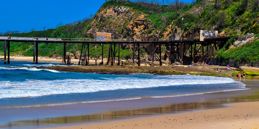 Historic pier at Catherine Hill Bay, a place to visit near Caves Beach