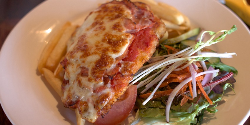 Chicken parmigiana, a cheesy classic that’s always a crowd-pleaser.