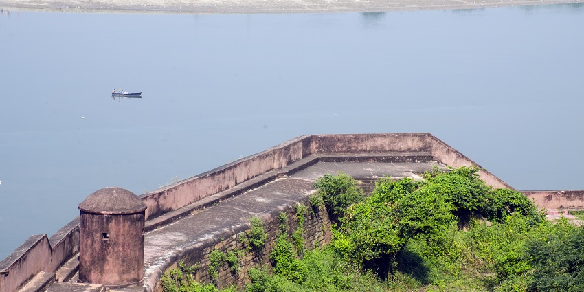 An image of Chunar Fort built from stones with curved windows and a wide space next to it