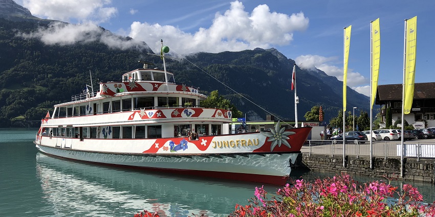 Relaxing boat cruise on serene Lake Brienz surrounded by mountains