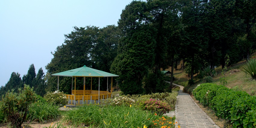 An image of Deolo Hill in Kalimpong, featuring a lush green landscape with rolling hills.
