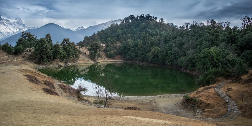 Explore Deoria Tal's waters, offering views to Koteshwar Temple