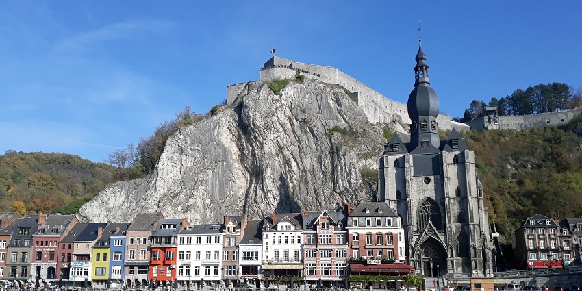 Scenic Belgian town along the Meuse River, known for its citadel.