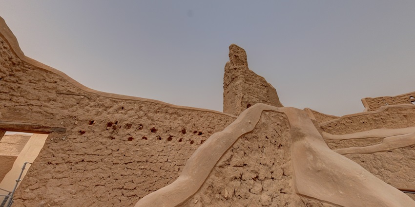 Salwa Palace in Diriyah, a historic mud-brick structure under a clear blue sky–Places to visit in Saudi Arabia