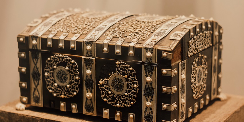 A picture of an antique ornate box displayed at the Kolkata GPO Postal Museum.