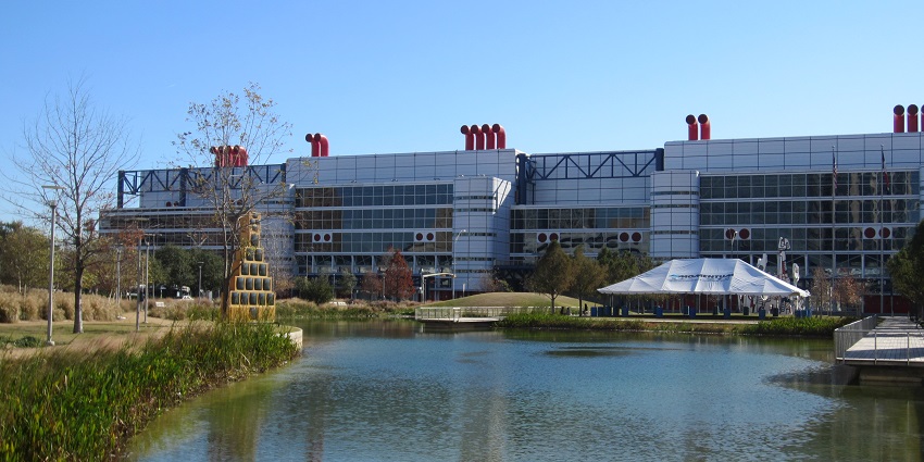 Discovery Green with a small lake body, dried-out winter trees and convention centre