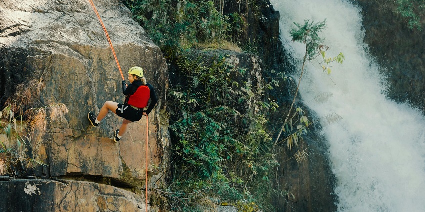 Experience adventurous rock climbing in nature with scenic surroundings in Rishikesh.