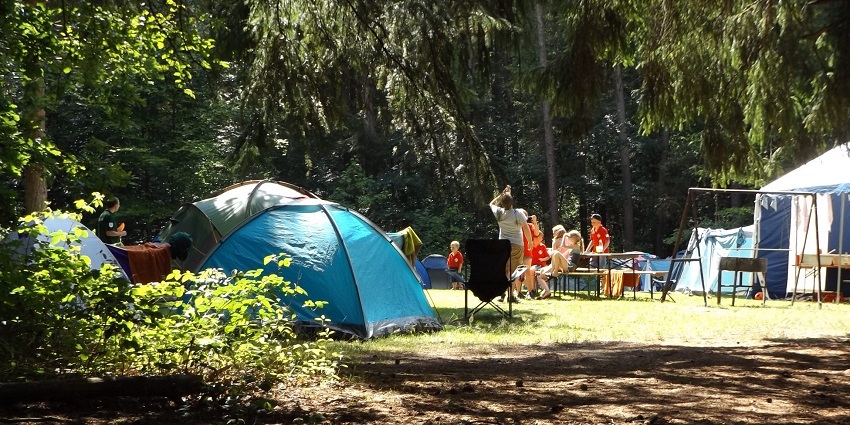 Camping in Ranikhet amidst nature, promoting environmental conservation practices.