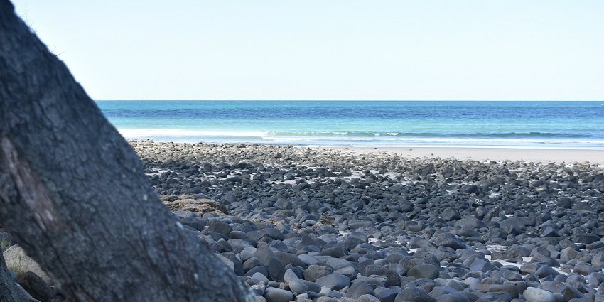 Broad stone band covering the shore at Elliot Heads Beach near Bundaberg.