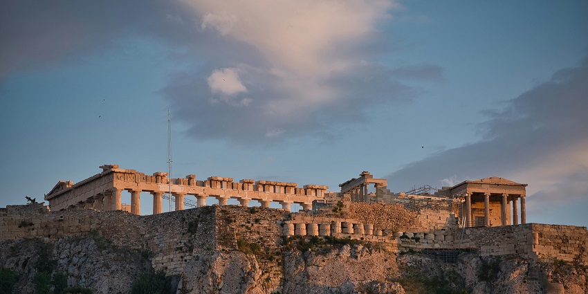 Parthenon structure with ruined architecture on Acropolis Hill with cloudy weather