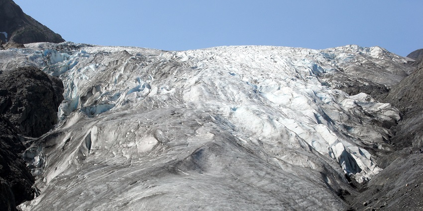 An image of Exit Glacier’s towering ice and rugged landscape showcases Alaska’s natural beauty