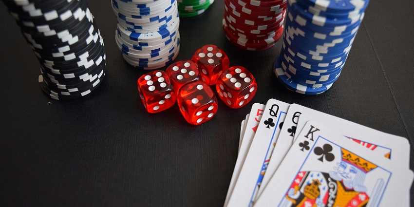 Poker chips and cards, along with dice, are kept on a table in a casino.
