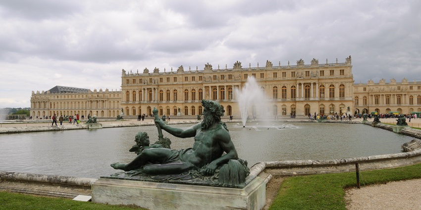 Extravagant royal residence with captivating gardens and opulent interiors.