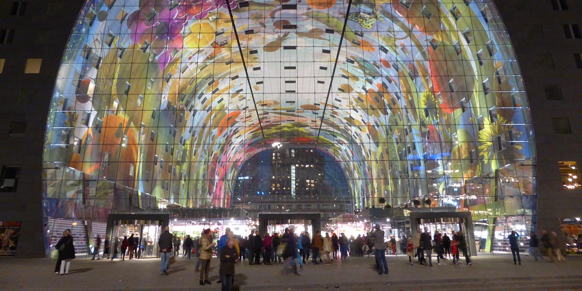 Vibrant indoor market with food stalls, shops, and dining options
