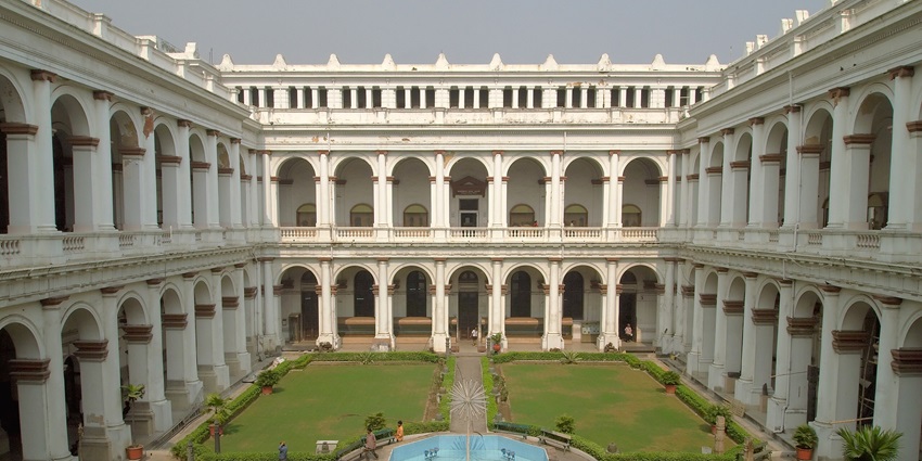 View of Indian Museum courtyard in Kolkata, featuring colonial architecture, arched corridors, and open central space