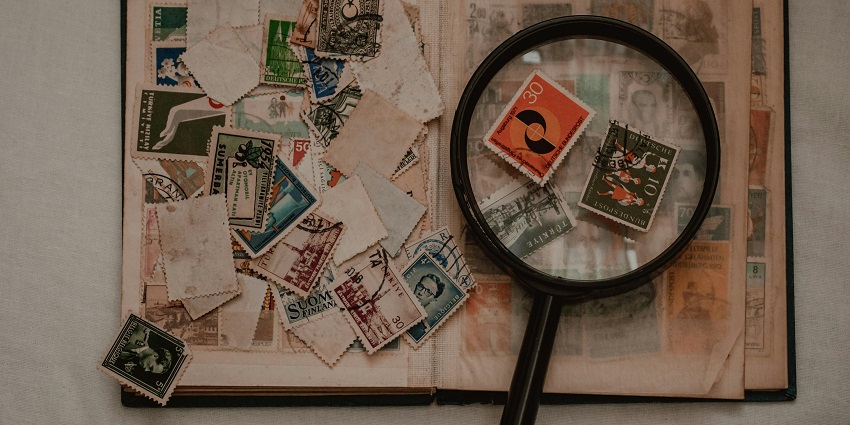 A picture of a close-up of vintage stamps, inspired by Kolkata GPO Postal Museum.