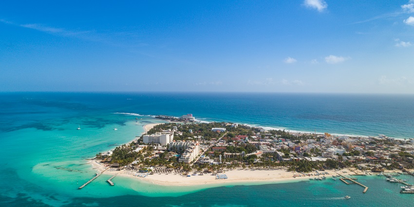 An aerial view of the Isla Mujeres shows a narrow strip of highly populated island, one of the things to do in Cancun.