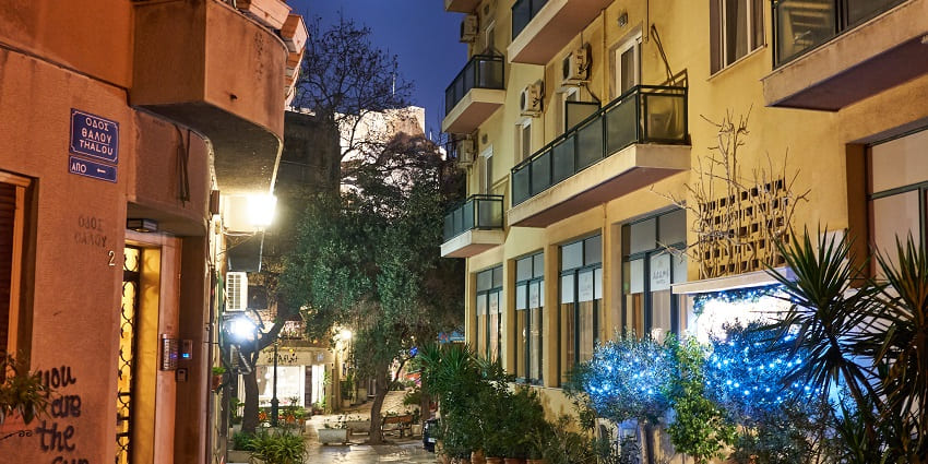 Chairefotos Street in Plaka village with vibrant buildings, balconies and air conditioners
