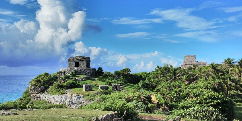 The Temple of the God of Wind (at left) in Tulum Mayan ruins near Cancun, Quintana Roo, one of the things to do in Cancun.
