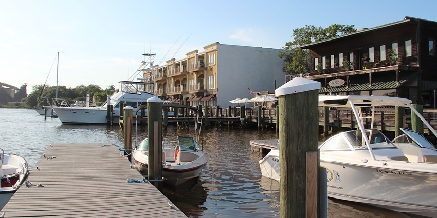 Scenic Georgetown harbor with boats docked along the waterfront under a clear sky–Things to Do in Washington D.C