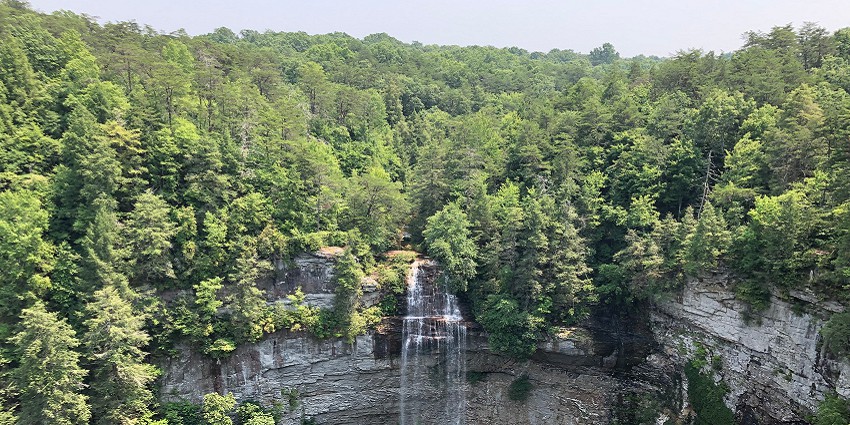 Fall Creek Falls in Tennessee, surrounded by rich greenery and rocky cliffs, one among the waterfalls in the USA.