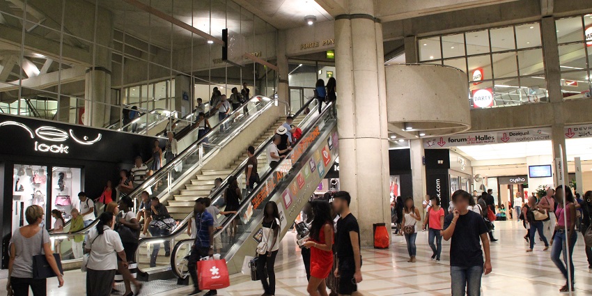Large shopping mall with a variety of stores and eateries in paris