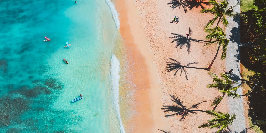 Aerial view of a clear sandy beach just like the Foster Avenue Beach in Chicago.