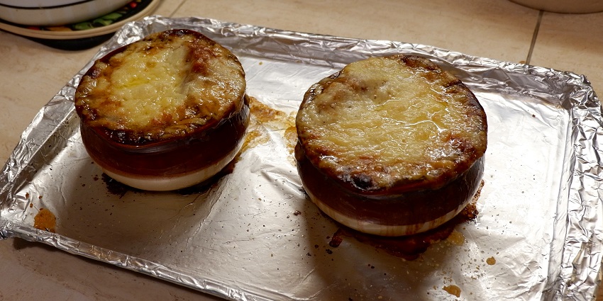 The best food in Paris is the classic French onion soup topped with melted cheese and bread.
