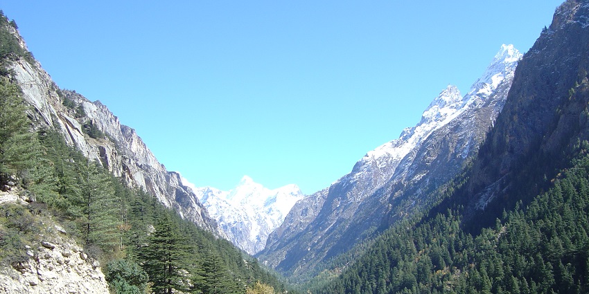 Stunning mountainous views surrounding Gangotri, highlighting lush greenery and peaks.
