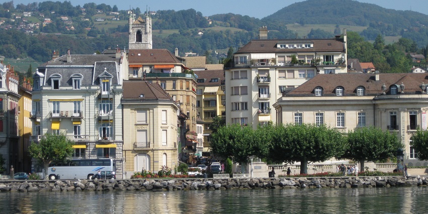 Cosmopolitan city with international organizations, lake views, and historic sites