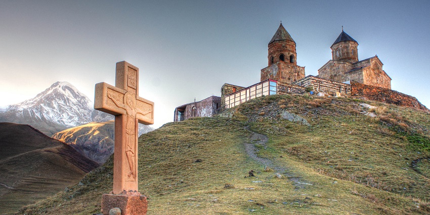 Gergeti Trinity's breathtaking mountain views inspire spiritual reflection.