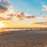 Relax and unwind at Glenelg Beach, one of the top beach destinations in Australia.