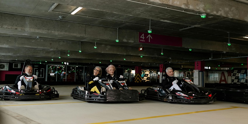 An image of a go-karting track in Kolkata with the racers competing on the circuit.
