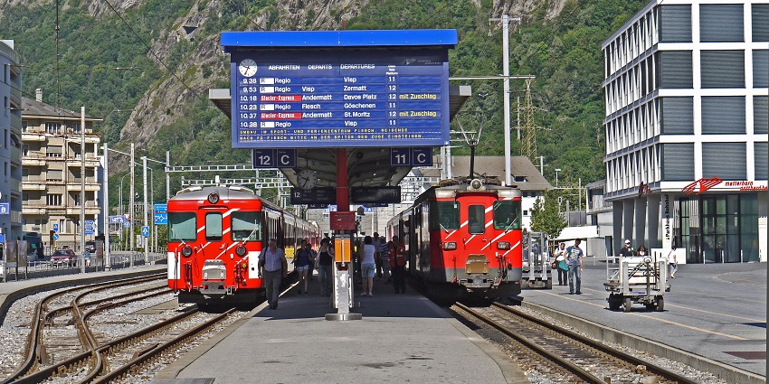 Scenic train journey through breathtaking Swiss landscapes and mountain views.