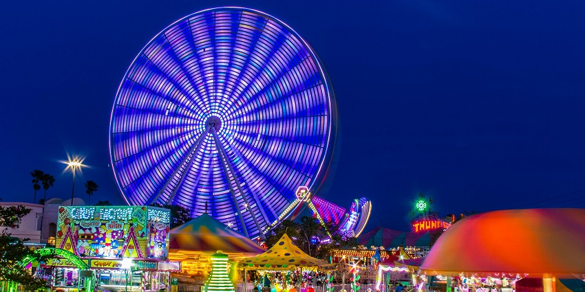 Image of a park in the evening - Family-friendly amusement park with rides and attractions