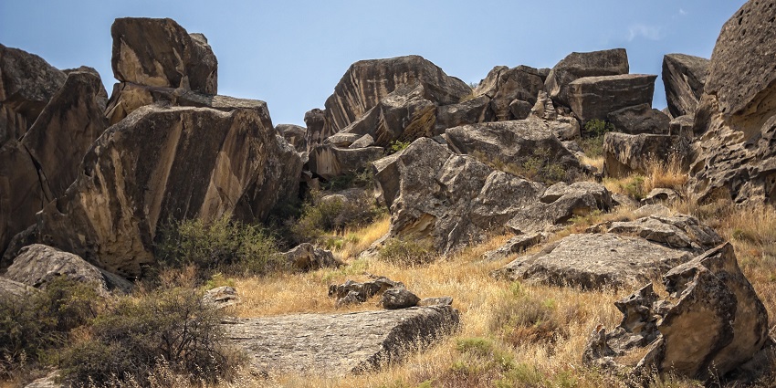 Ancient rock formations and petroglyphs in a UNESCO World Heritage Site.