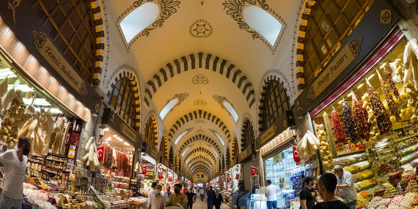 An image of Grand Bazaar, a bustling market with shops selling jewellery, and souvenirs.