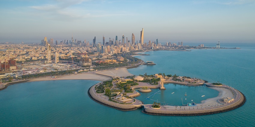 A breathtaking aerial shot of the Green Island in Kuwait with azure blue waters.